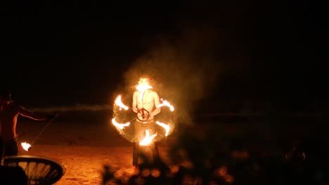 performer displays fire skills on krabi beach