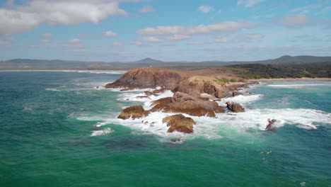 aerial drone view towards the look at me now headland bay, in sunny australia