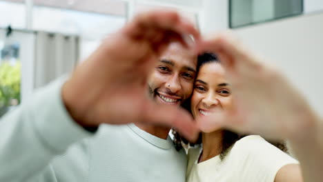 couple, smile and heart hands in home portrait