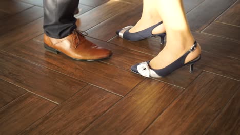 SLOWMO---Couple-dancing-waltz-at-wedding-close-up-of-feet