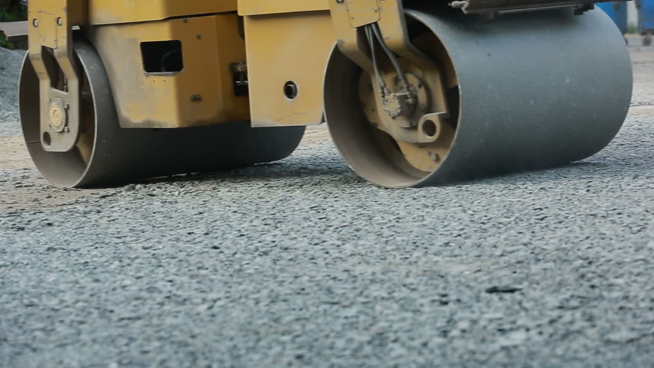 Road Roller Working On Road. Road roller working on the new road construction site