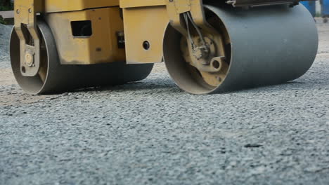 road roller working on road. road roller working on the new road construction site