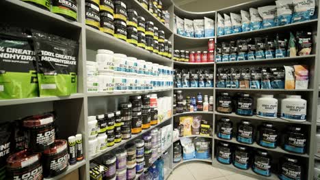 sport nutrition store interior with large choice of nutritional supplements.