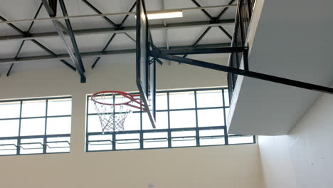 indoor basketball hoop in a gymnasium, with copy space