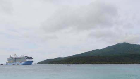cruise ship anchored in between aneityum island and mystery island, vanuatu.