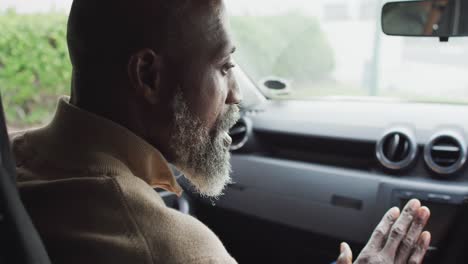 Video-of-african-american-father-learning-son-how-to-drive-a-car