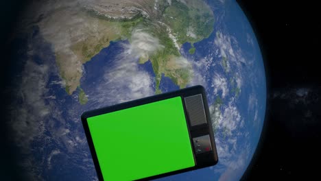 3d animation of television set in the space. television set with green screen orbiting and monitoring the earth from space.
