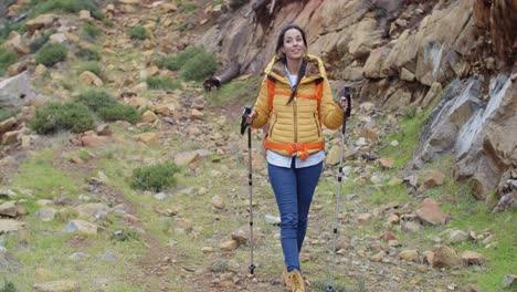 fit healthy young woman hiking on a trail