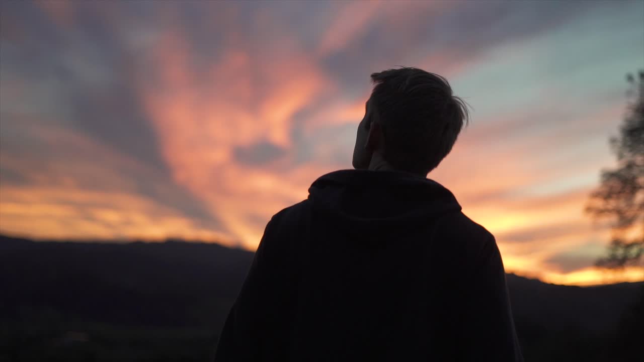 John walks towards a beautiful sunset in Wine Country, California.