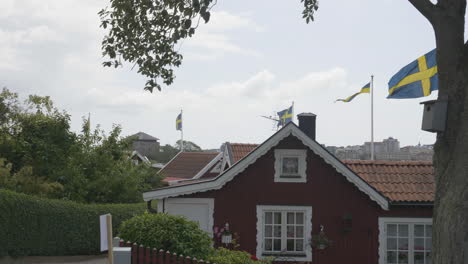 charming red summer houses on national day in sweden