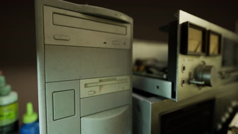 exploring a retro computer and vintage audio equipment in a dimly lit room