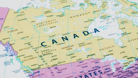 close-up of the country word canada on a world map with the detailed name of the capital city