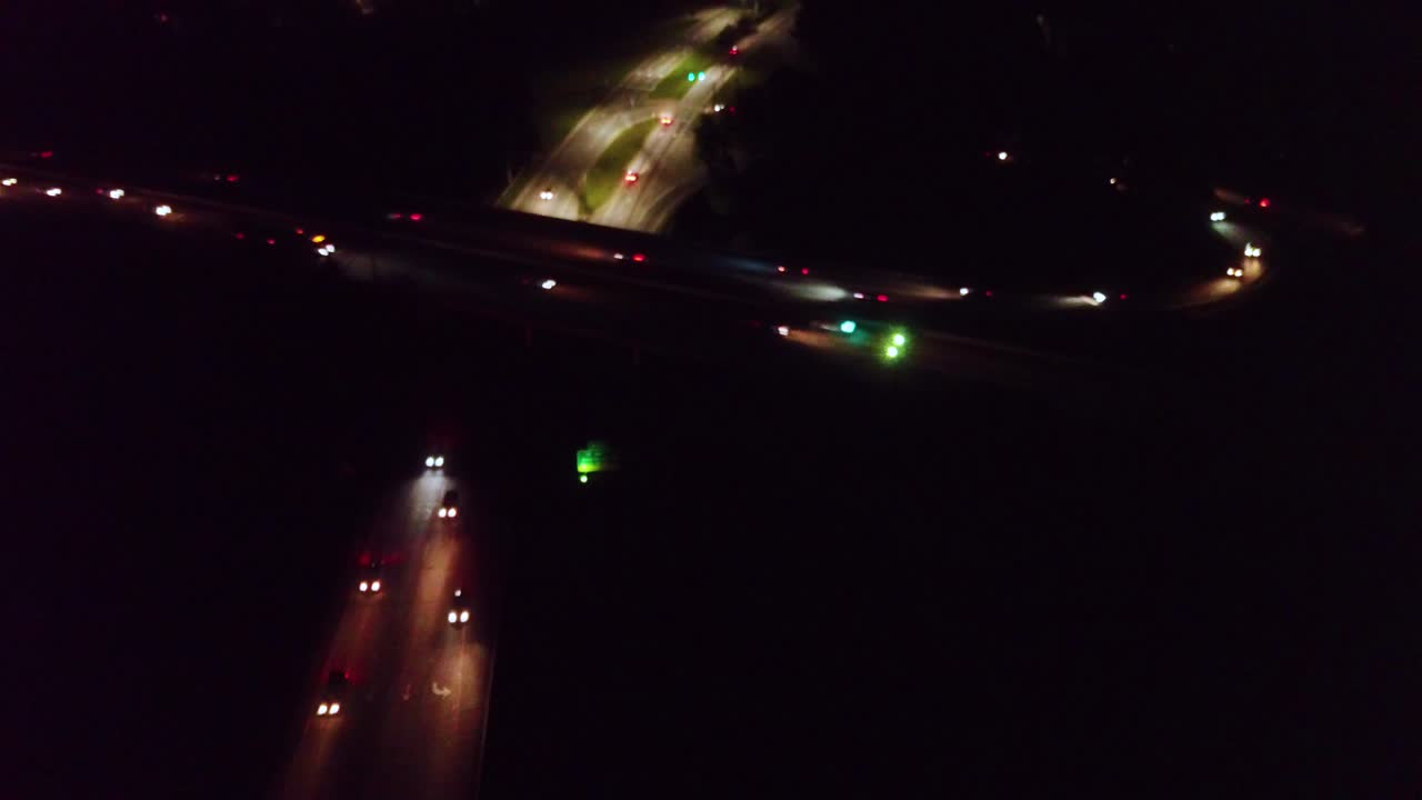 Overhead drone view of nighttime busy highway traffic Raleigh North Carolina