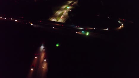 overhead drone view of nighttime busy highway traffic raleigh north carolina