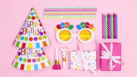 birthday party layout made of parry accessories and decorations appear on pastel pink theme. stop motion