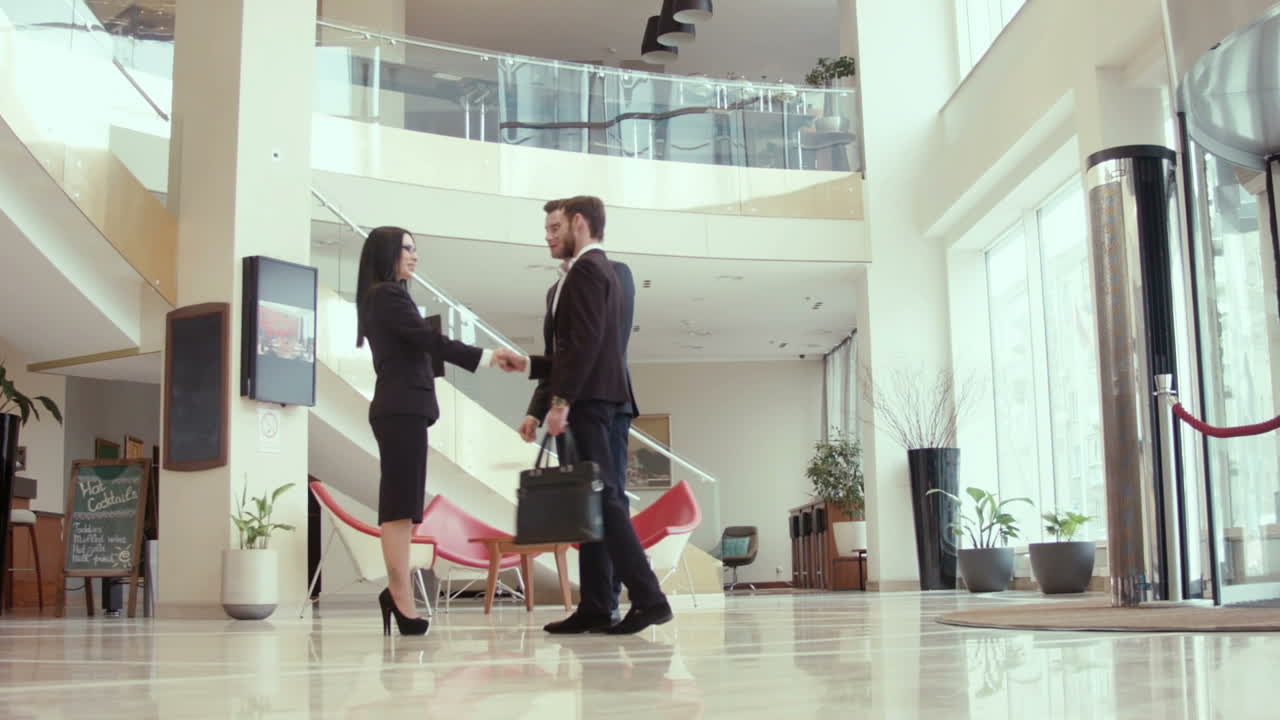 Businessmen Meet And Go To a Negotiating Table (Stock Footage)