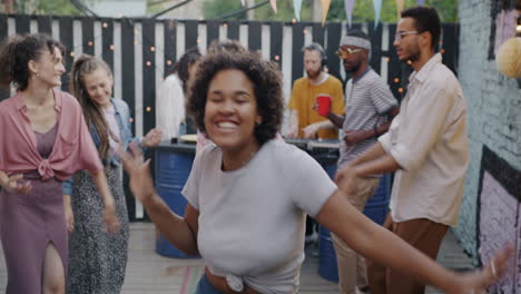 friends dancing at backyard party