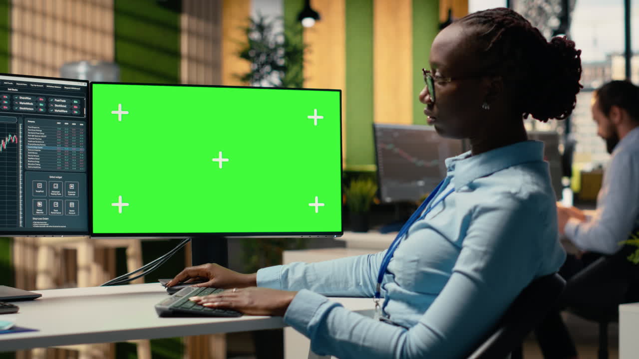 Portfolio manager analyzes stock market trends on green screen PC