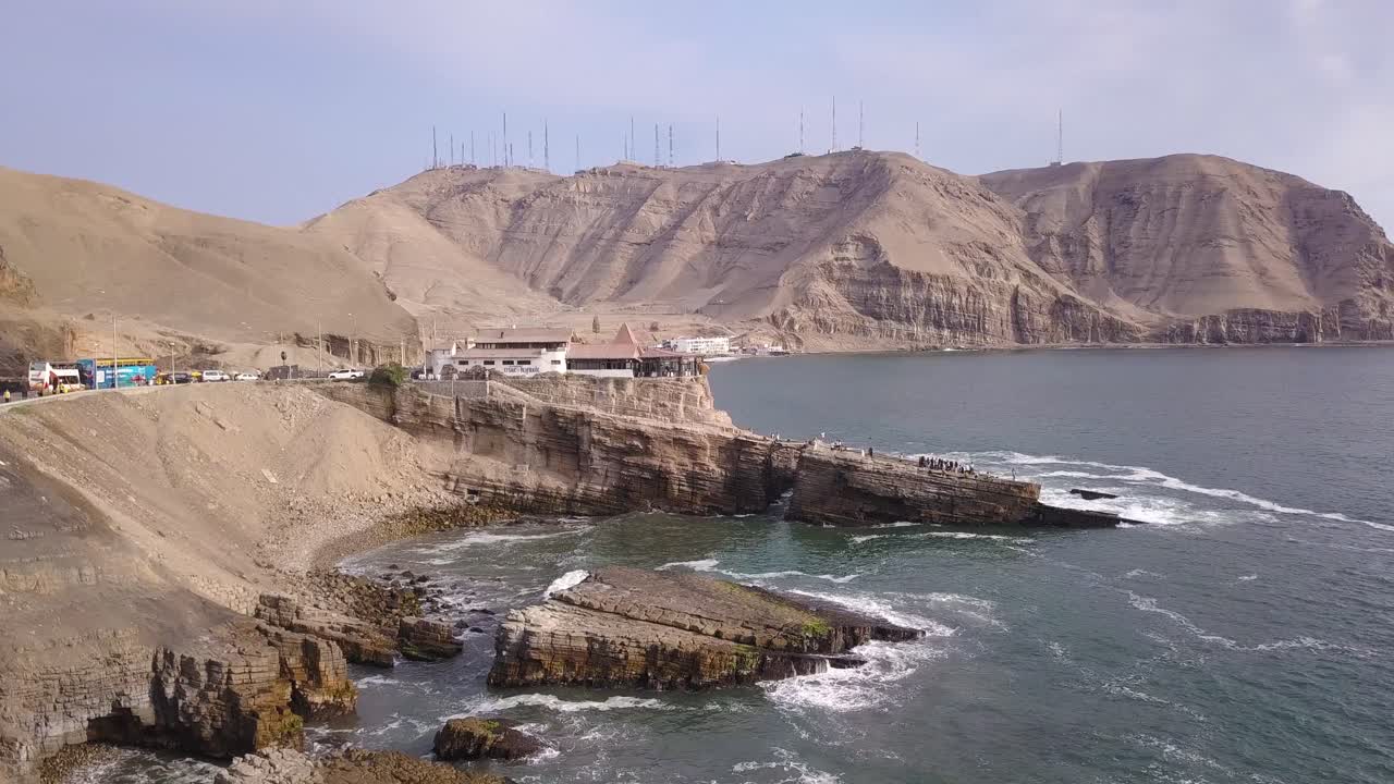 Stunning aerial shot of rugged coastal cliffs, winding roads, and deep blue ocean waves. Ideal for travel blogs, editorial use, and premium wall art. Leap of the Friar.