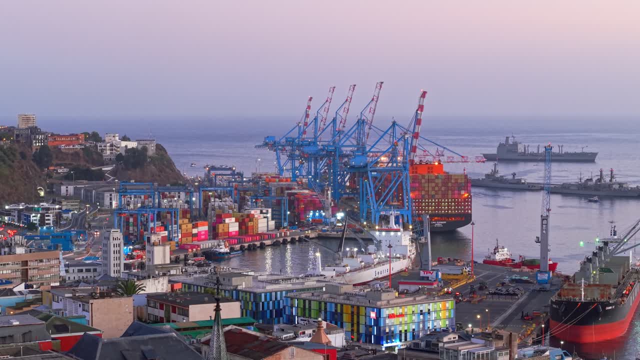 The Chilean port of Valparaiso with a cargo ship at dawn, aerial view