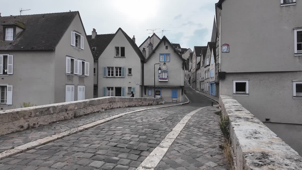 Chartres Bouju bridge over river Eure, with quiet cobbled street and medieval architecture, France, Loire Valley