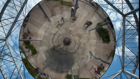 reflective circular structure with people