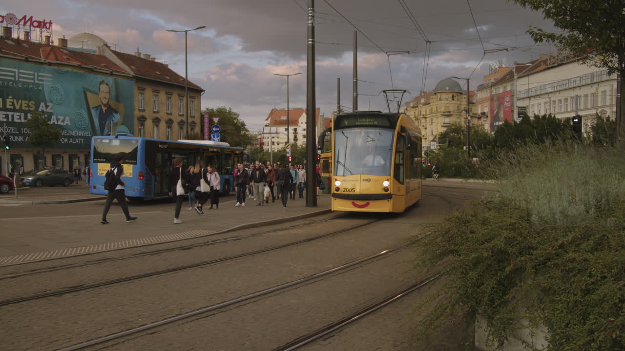 People are waiting for public transport vehicles, Hungary, Budapest, downtown, Szell Kalman Square ( Széll Kálmán Tér ).
