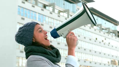 Hipster-shouing-through-megaphone-outside