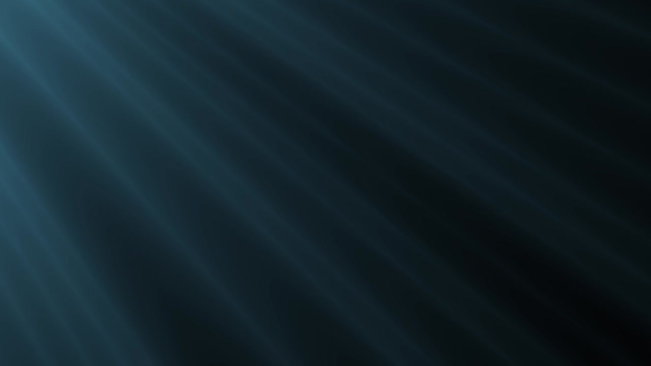 Soft, atmospheric blue volumetric light rays gently drift from top left on dark background. For moody intros, underwater scenes, or abstract visuals