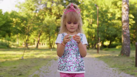 Stylish-child-girl-playing-colorful-squishy-silicone-bubbles-sensory-toy-simple-dimple-pop-it-game