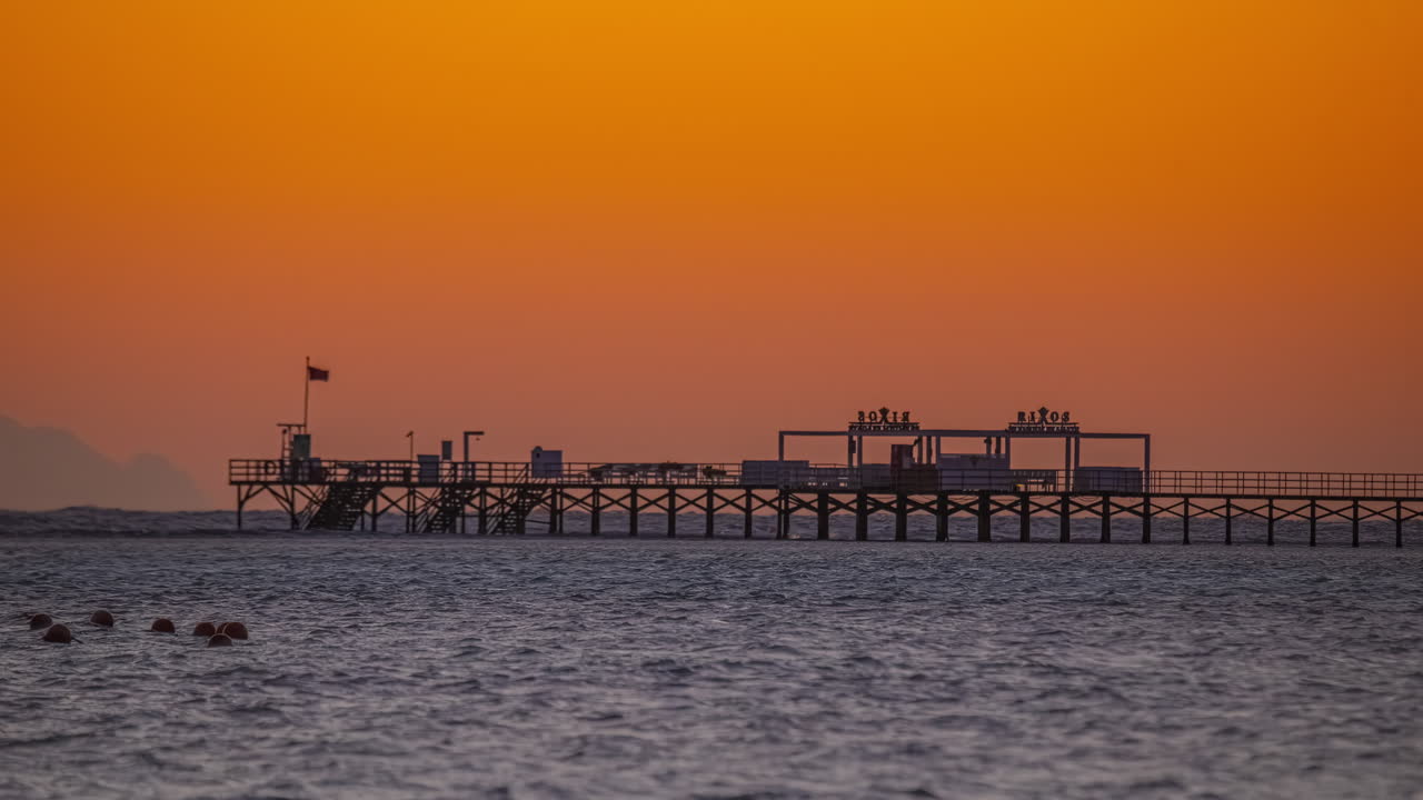 Time lapse sea and pier dock after sunset, golden hour Sharm El Sheikh