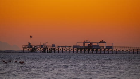 Time-lapse-sea-and-pier-dock-after-sunset,-golden-hour-Sharm-El-Sheikh