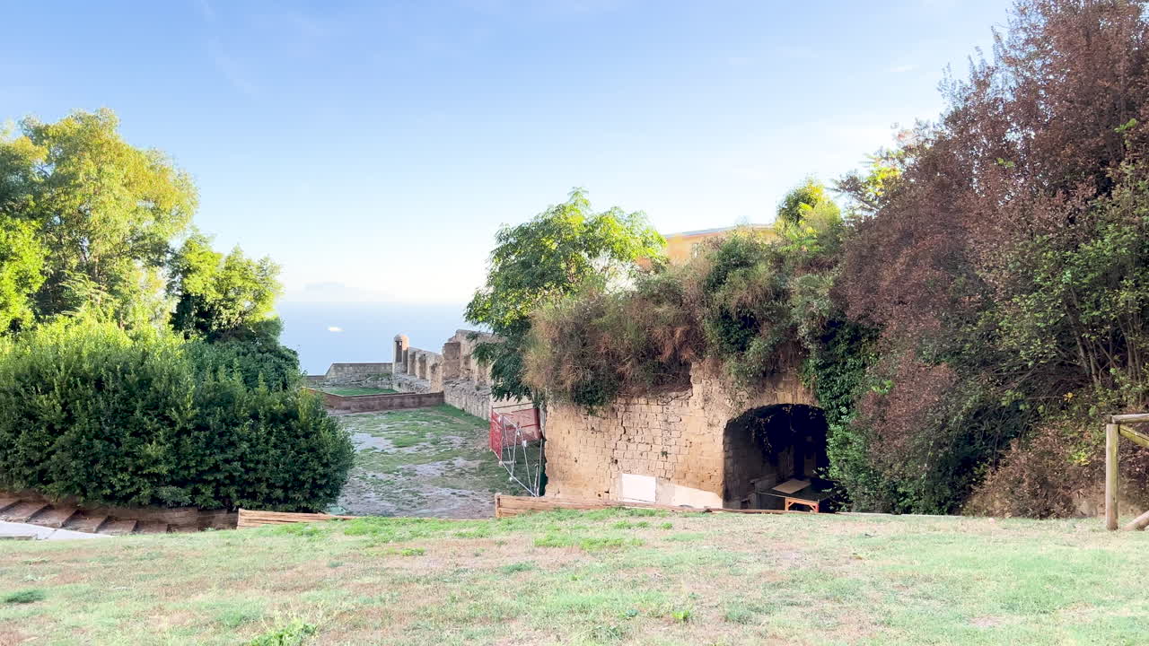 Historical ruins with greenery in a serene landscape in Sant'Elmo, Naples