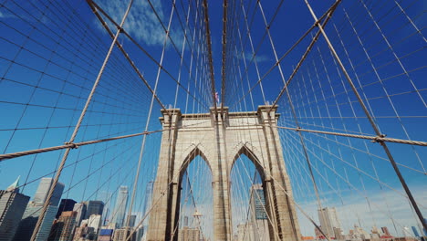First-Person-View-Of-The-Brooklyn-Bridge-In-The-Direction-Of-Manhattan-Seen-Beautiful-Pillars-Of-The