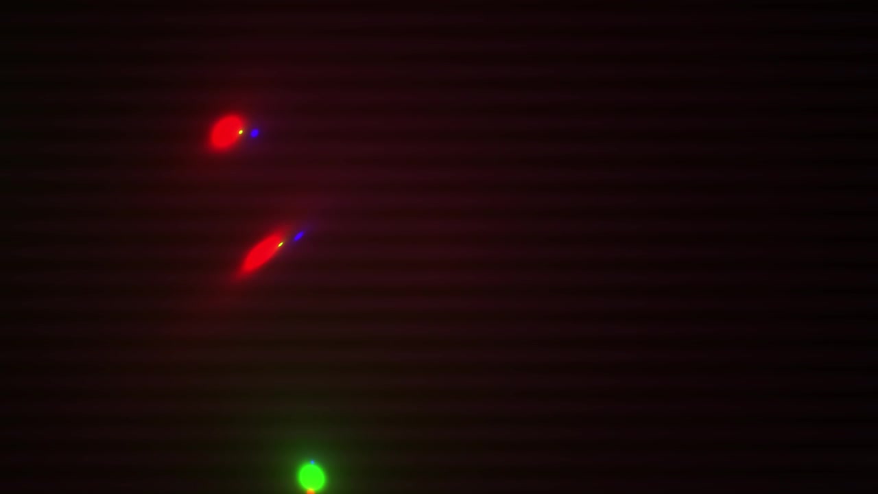 Dynamic Red and Green Glowing Lights on Black Background