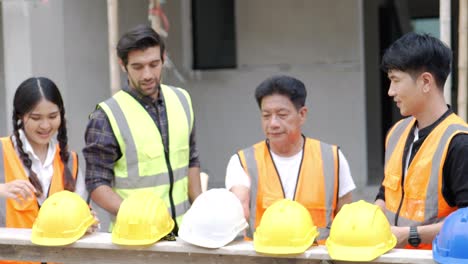 civil engineers prepares to work with team on building site while wearing a safety helmet