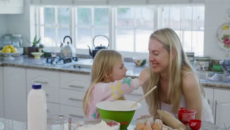 Mother-and-daughter-making-christmas-cookies-at-home