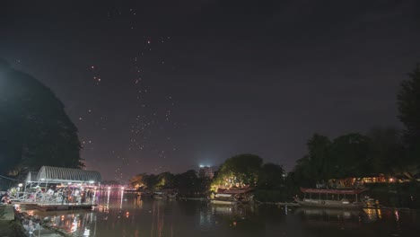night river festival with sky lanterns
