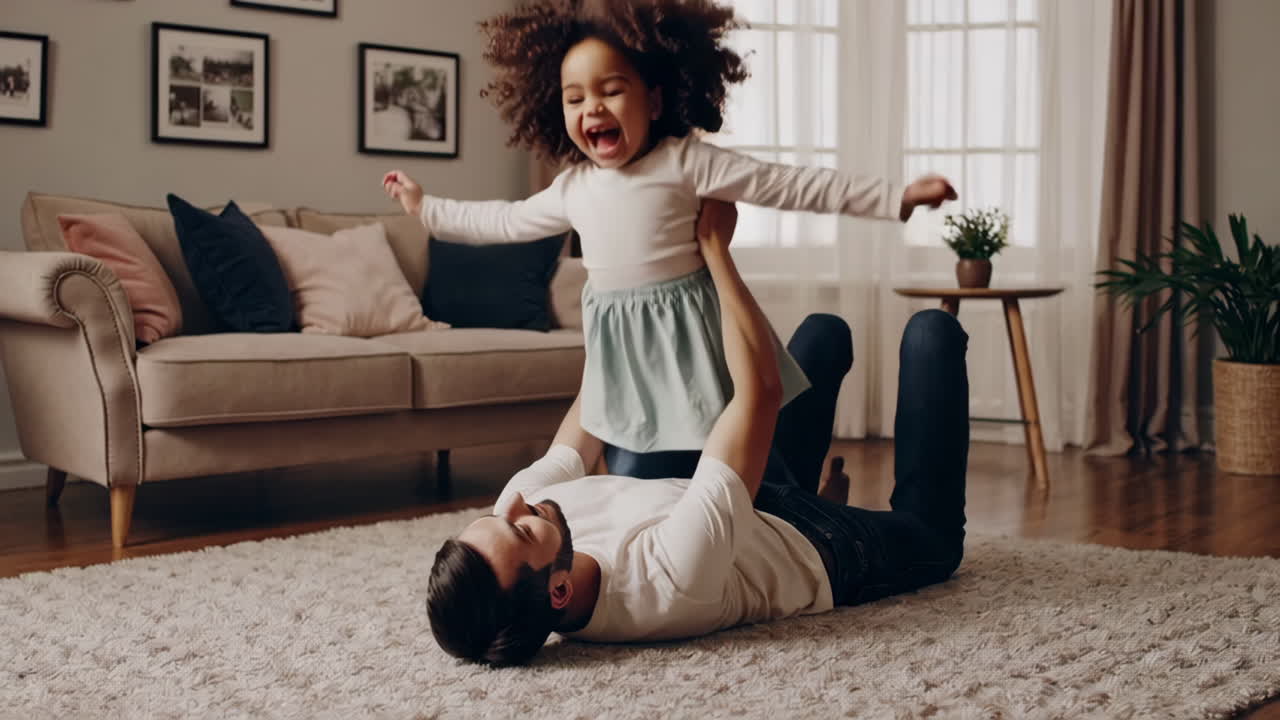 Father and daughter playing together in the living room