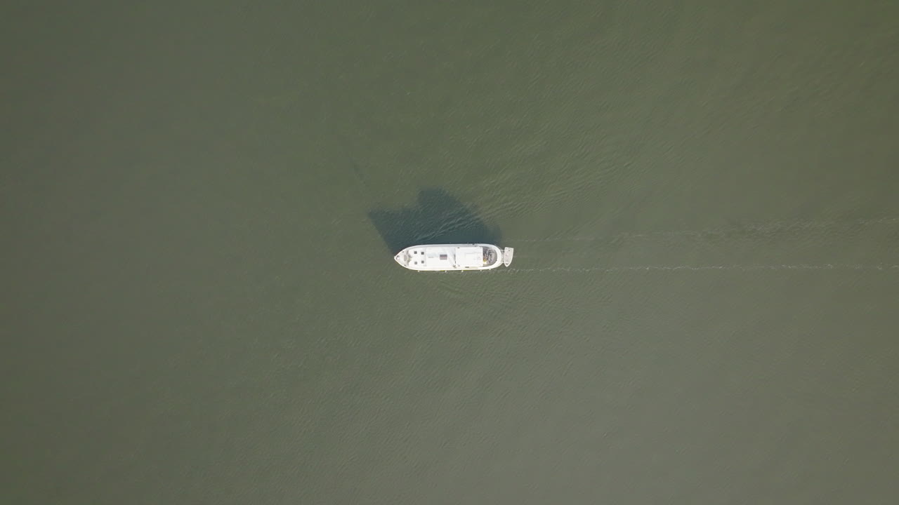 Morning views as the crow flies of the Dutch boat Luxe Motor crossing the calm sea