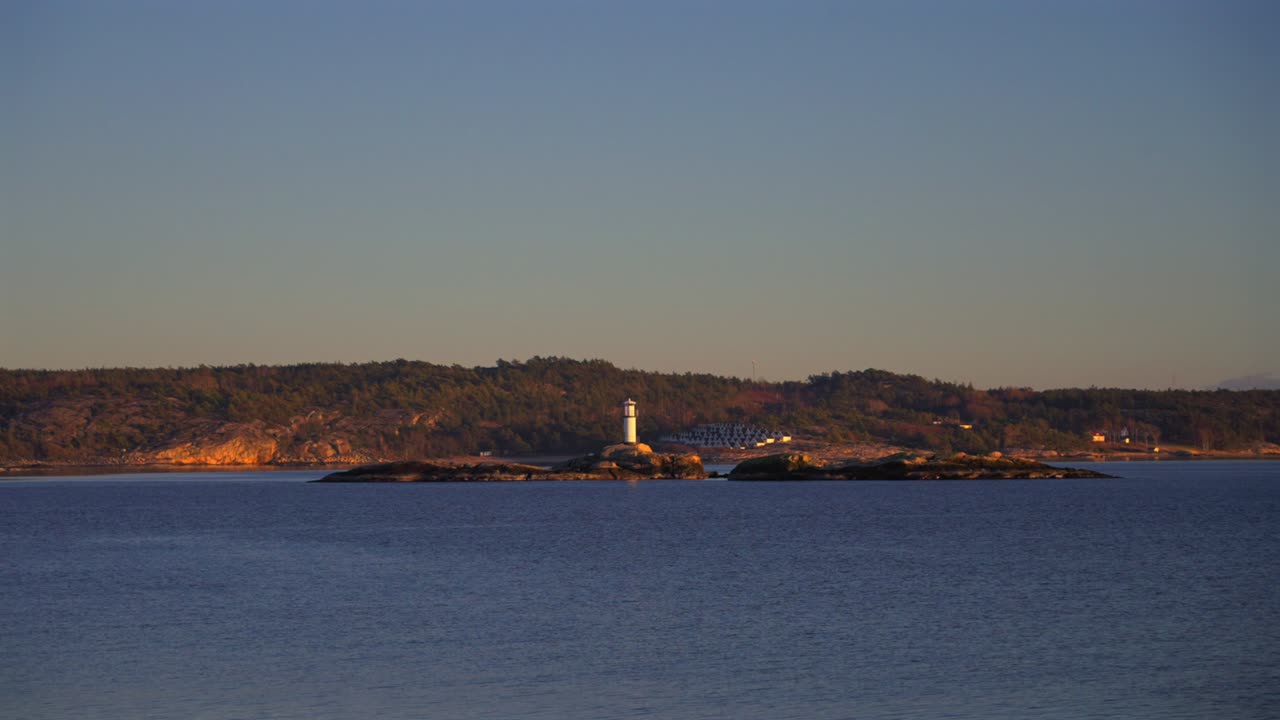 Strömstad Stromstad Oslo Fjord Ursholmen Lighthouse Ytre Hvaler National Park Sweden Sverige Norway Norge golden hour Arctic sunlight sunset ferry boat ride Scandinavia islands circle right motion