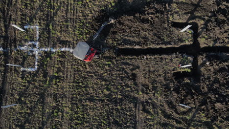 tractor in the process of working between the rows for solar panels