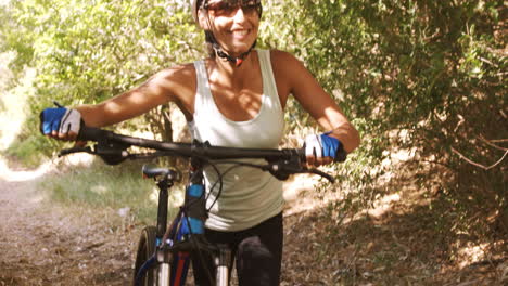 Sportswoman-walking-through-forest