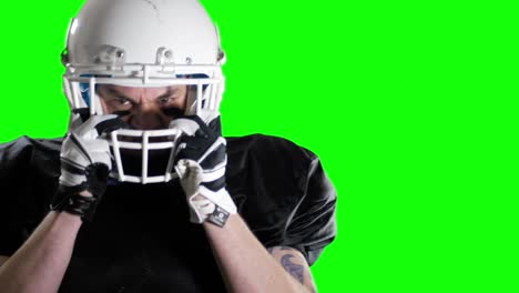 angry american football player ready for the game green screen chroma key