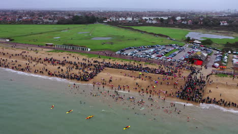 aerial panning across gosport new years day swim uk 4k