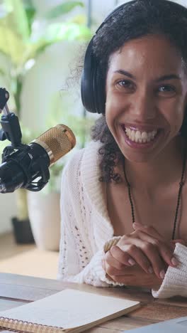 young happy african american woman journalist finishes speaking into microphone
