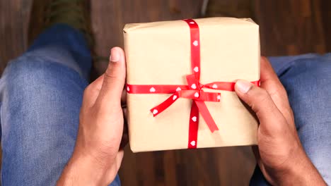 hands holding a wrapped gift