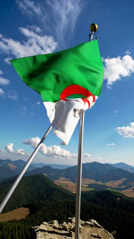 algerian flag flying high on mountain peak