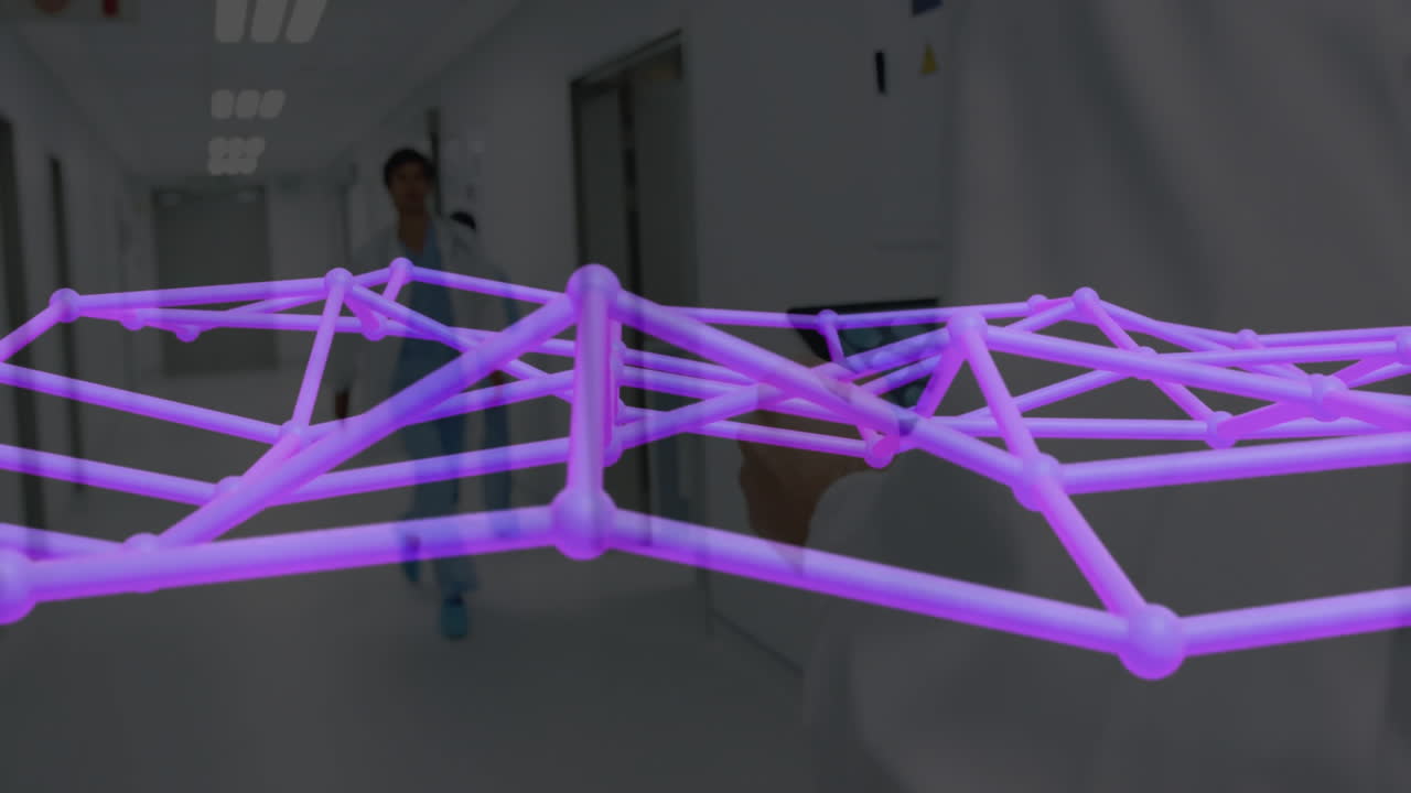 Medical team walking hospital corridor, projecting purple AR mesh overlay from tablet screen