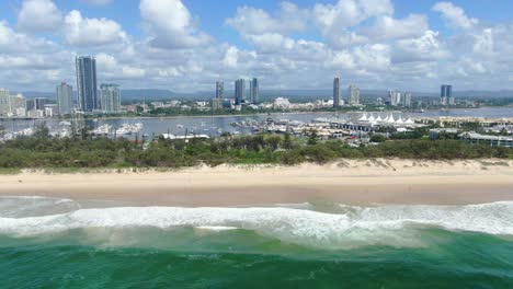 beach at gold coast spit looking over towards broadwater, clear summers day, marina yachts